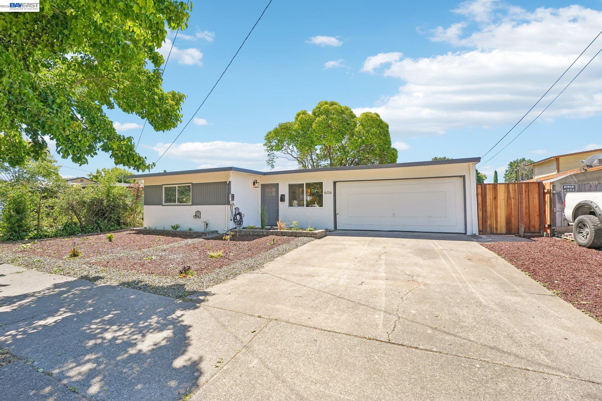 606 West 9th Street Santa Rosa, CA 95401 - Photo 2 of 52 a front view of a house with a yard and garage