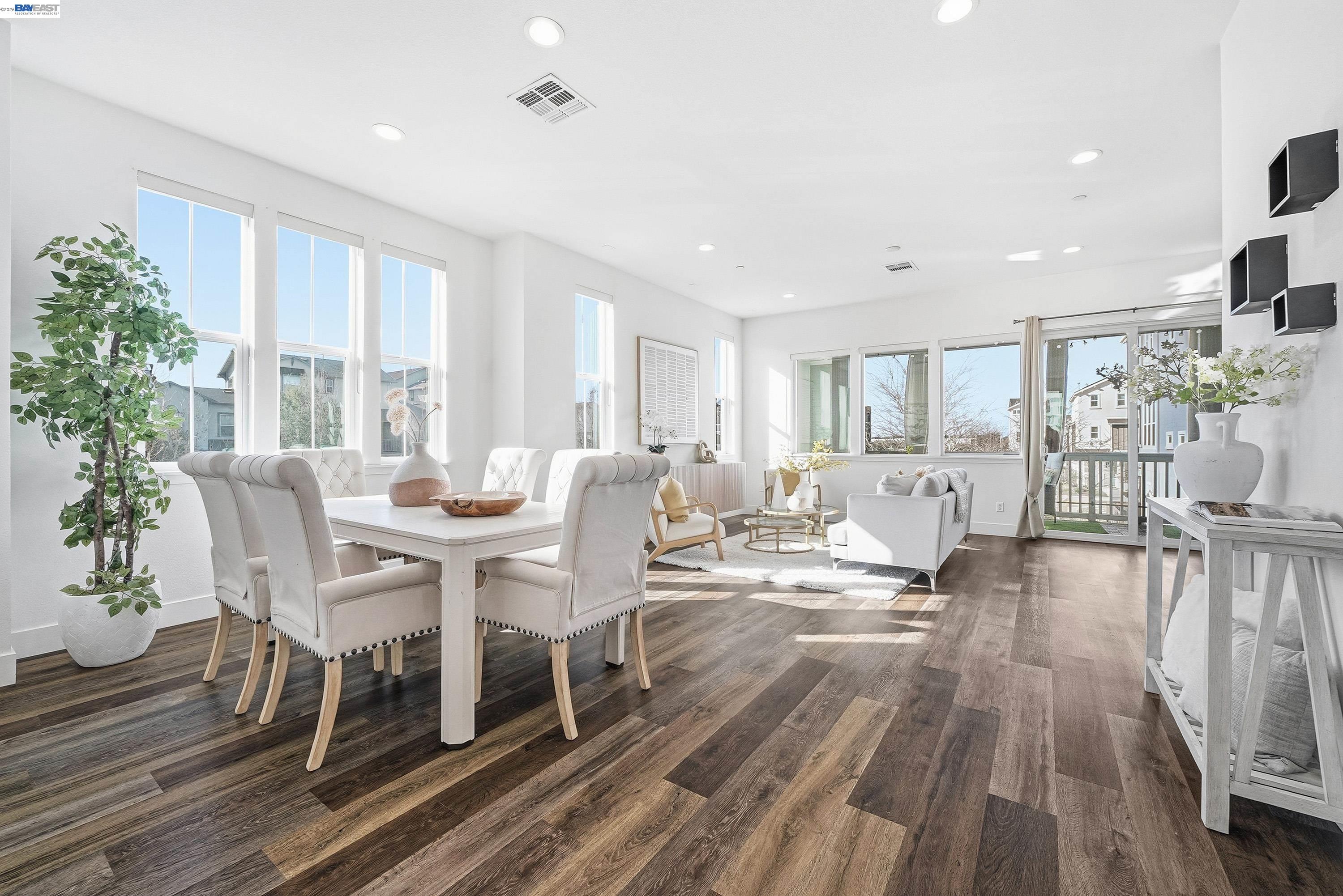 a view of a dining room with furniture window and wooden floor