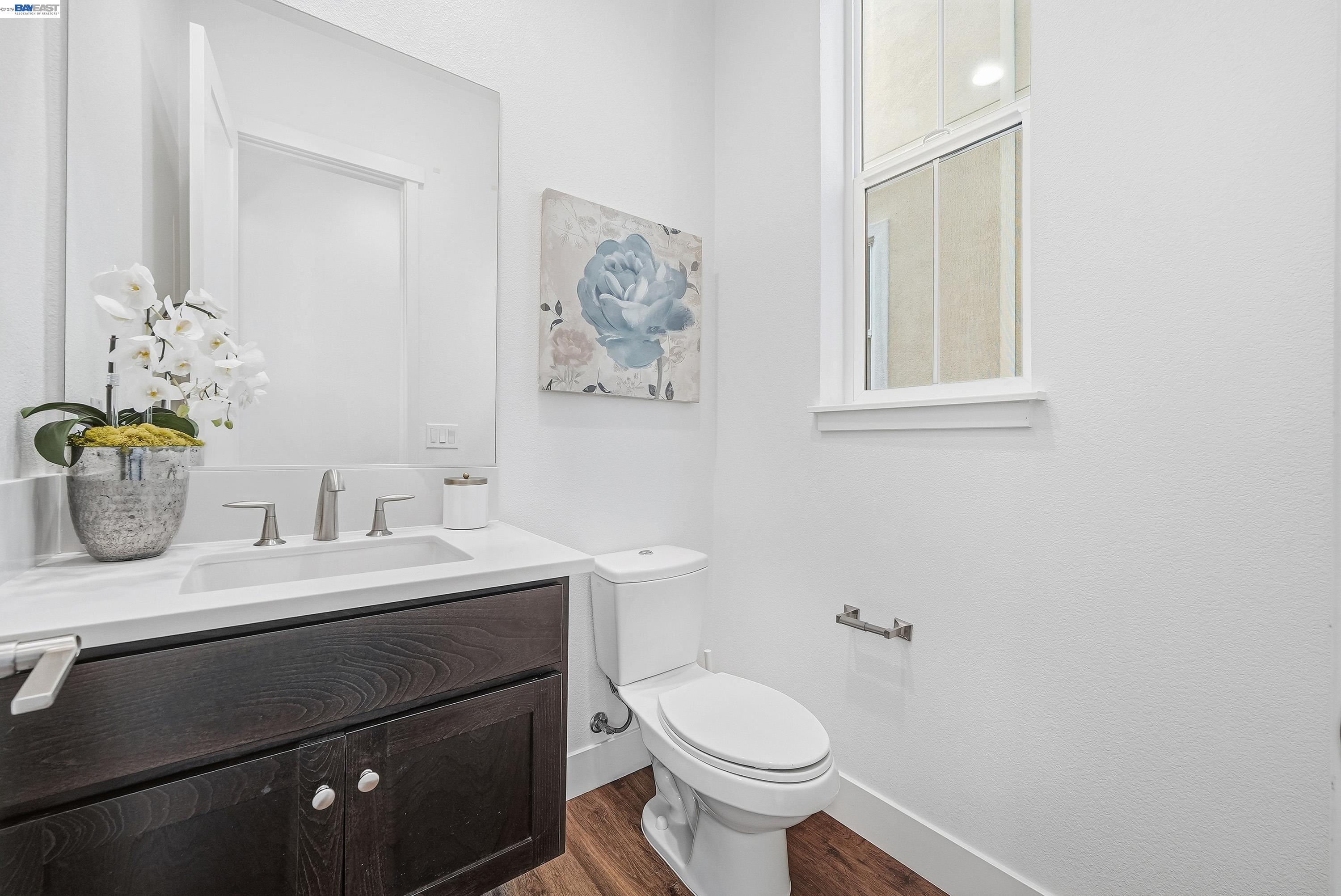 37645 Bay Crest Road Newark, CA 94560 - Photo 13 of 46 a bathroom with a toilet sink and mirror