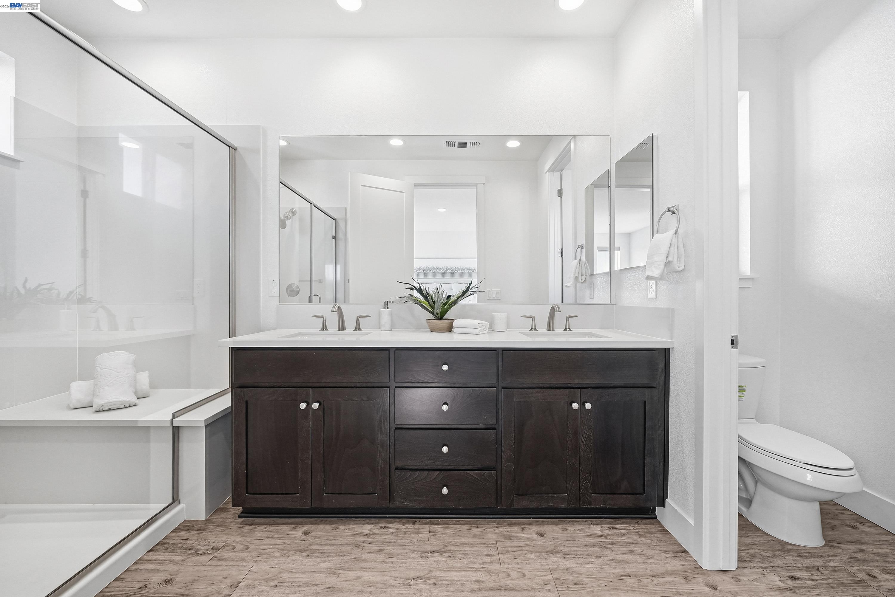 37645 Bay Crest Road Newark, CA 94560 - Photo 18 of 46 a bathroom with a sink vanity and a mirror