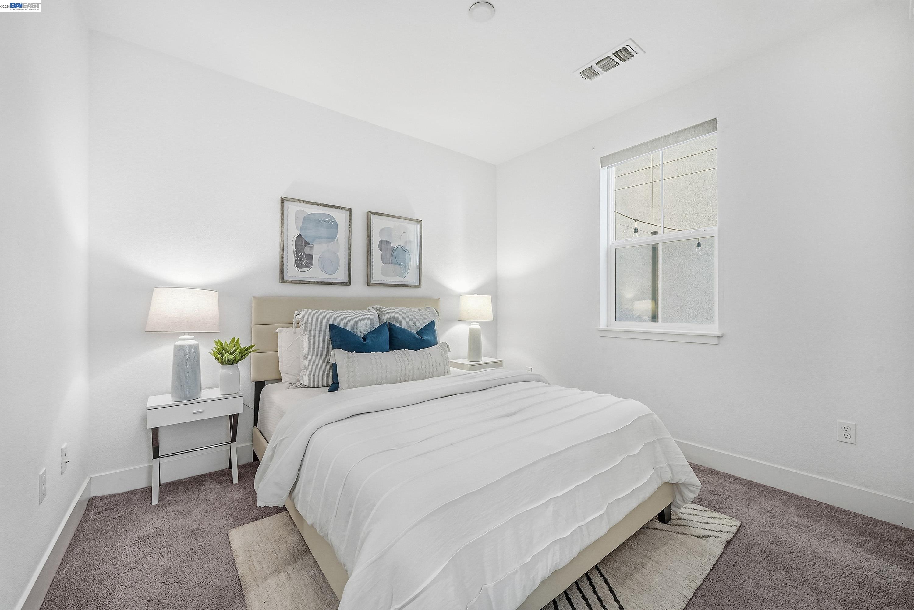 37645 Bay Crest Road Newark, CA 94560 - Photo 28 of 46 a bedroom with a bed and a painting on the wall