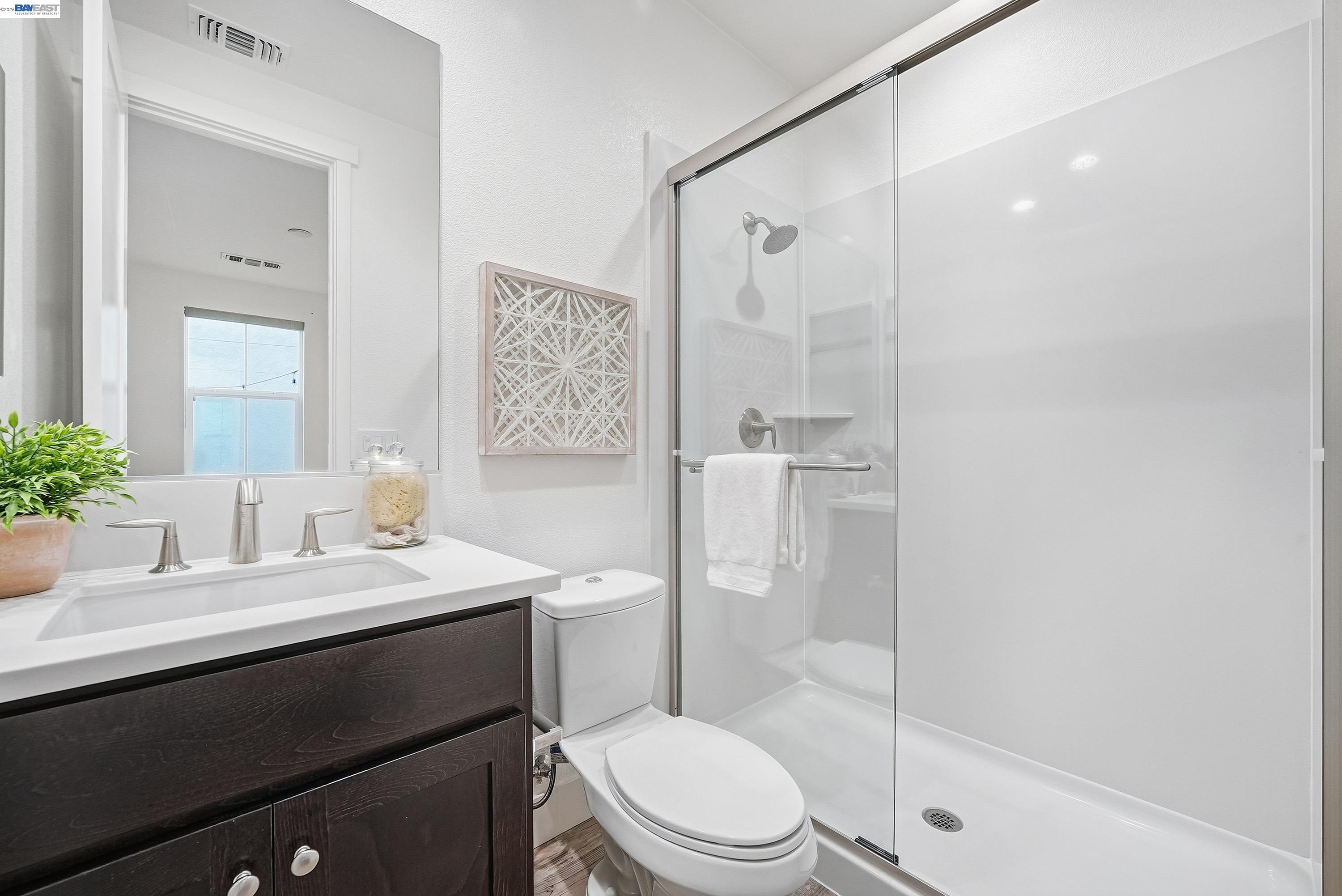 37645 Bay Crest Road Newark, CA 94560 - Photo 30 of 46 a bathroom with a sink a toilet and shower