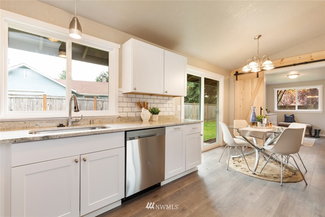 20711 Filbert Drive Bothell, WA 98012 - Photo 12 of 25 a kitchen with a sink and chairs