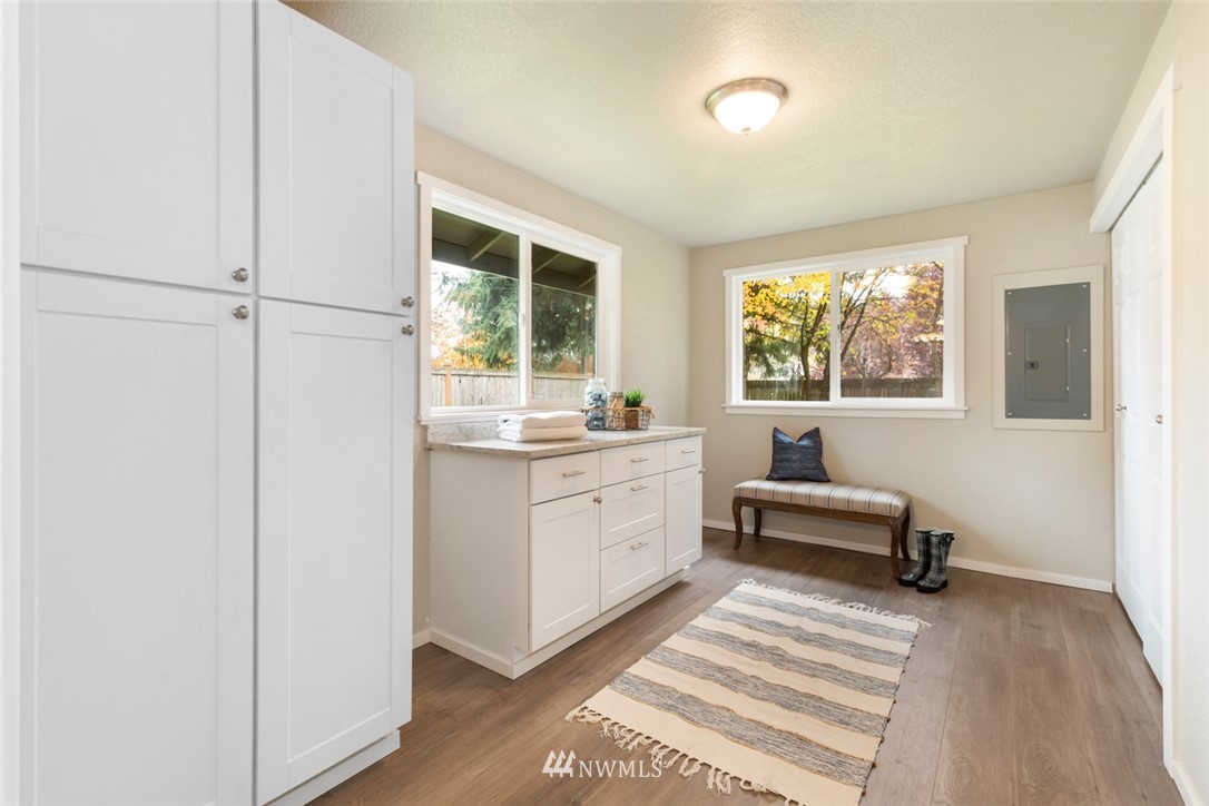 20711 Filbert Drive Bothell, WA 98012 - Photo 14 of 25 a kitchen with a refrigerator and windows