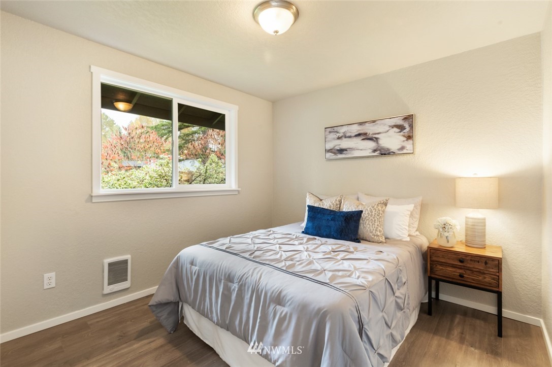 20711 Filbert Drive Bothell, WA 98012 - Photo 16 of 25 a bedroom with a bed and a window