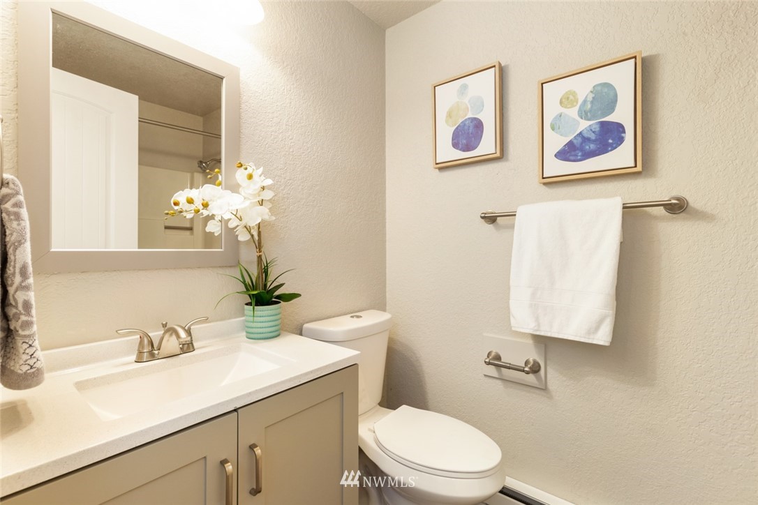 20711 Filbert Drive Bothell, WA 98012 - Photo 18 of 25 a bathroom with a toilet sink and mirror