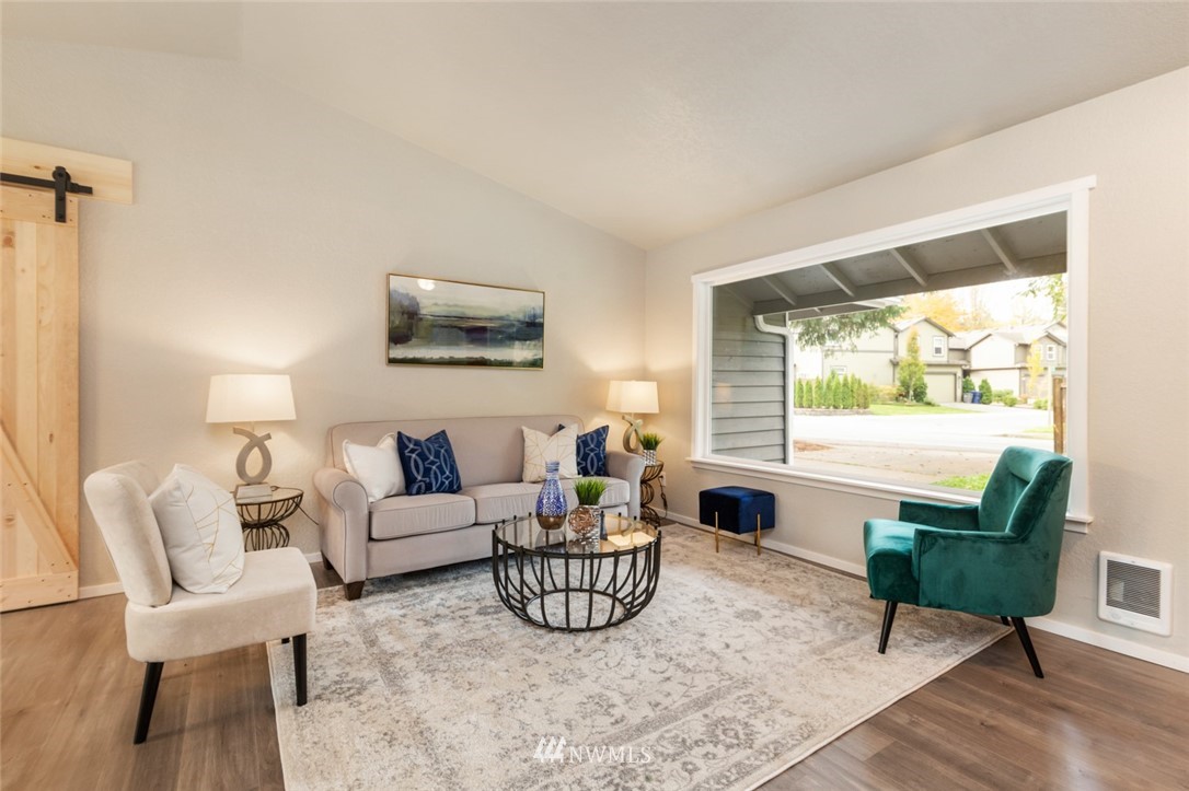 20711 Filbert Drive Bothell, WA 98012 - Photo 5 of 25 a living room with furniture and a large window