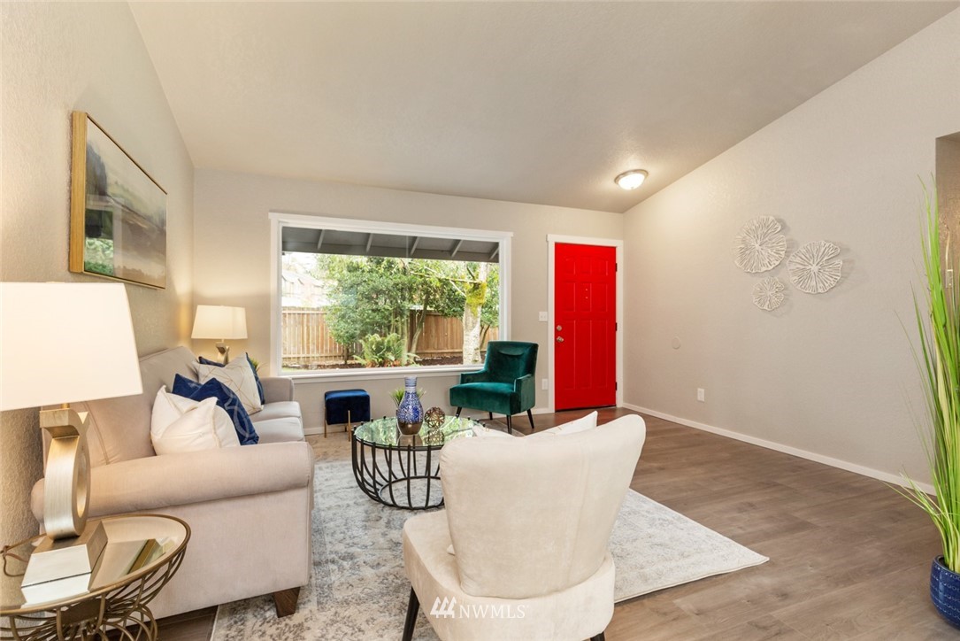 20711 Filbert Drive Bothell, WA 98012 - Photo 6 of 25 a living room with furniture and a large window