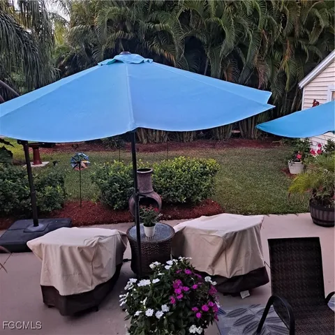 a view of yard with outdoor seating and green space