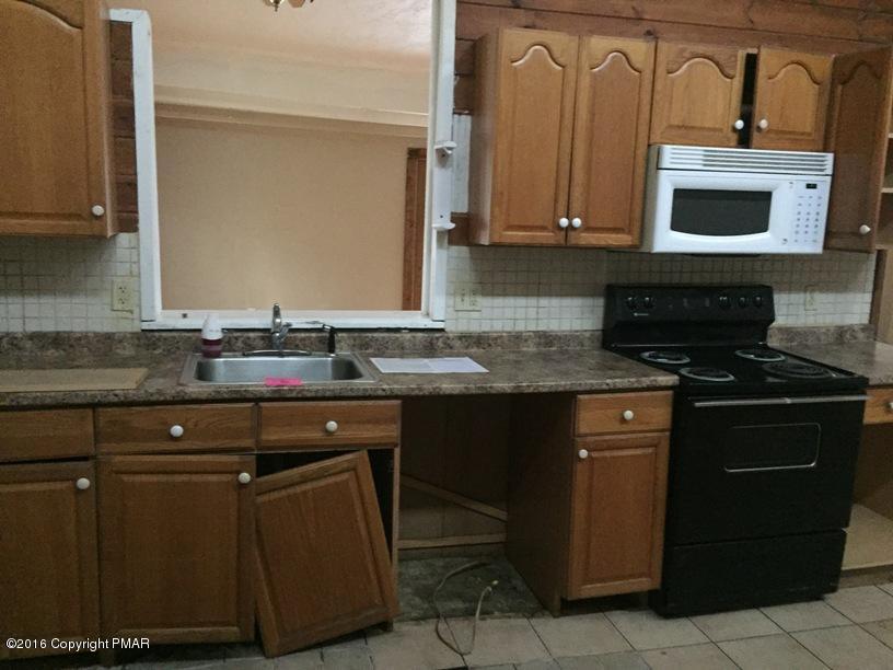 110 Center Avenue Mount Pocono, PA 18344 - Photo 3 of 14 a kitchen with stainless steel appliances granite countertop a sink and a stove