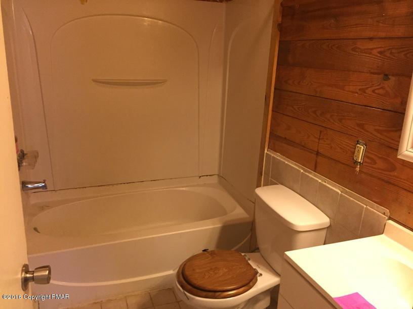 110 Center Avenue Mount Pocono, PA 18344 - Photo 10 of 14 a bathroom with a toilet and a shower