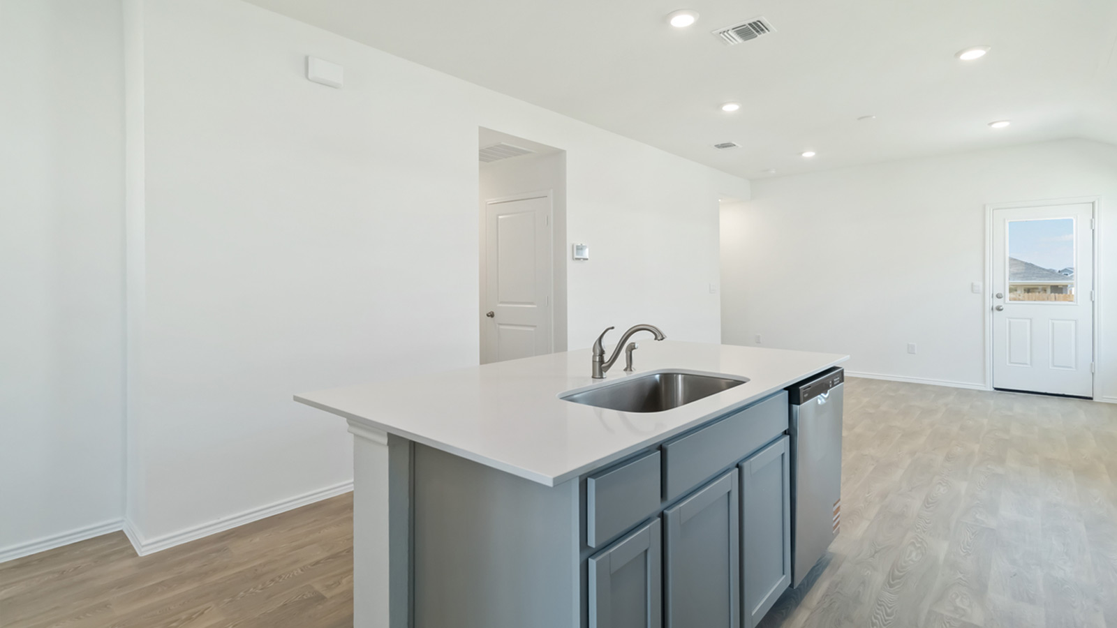 265 Balmorhea Street Kyle, TX 78640 - Photo 13 of 25 a kitchen with a sink and cabinets
