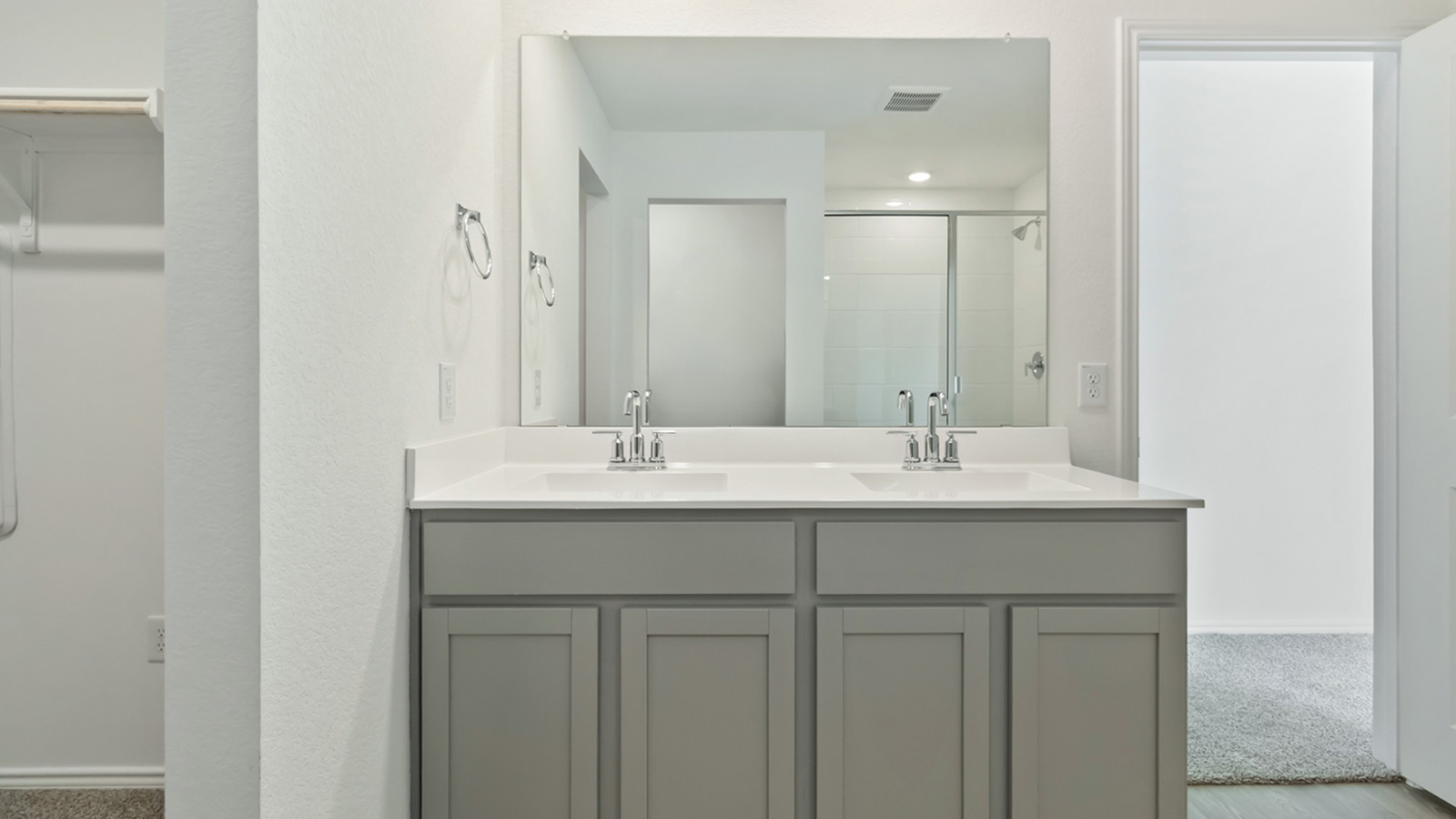 265 Balmorhea Street Kyle, TX 78640 - Photo 18 of 25 a bathroom with a sink and a mirror