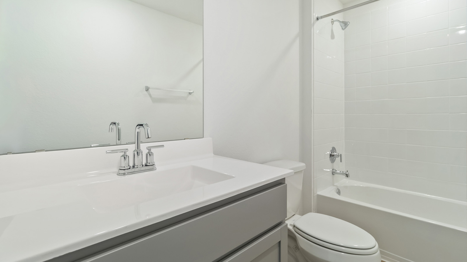 265 Balmorhea Street Kyle, TX 78640 - Photo 23 of 25 a bathroom with a sink a toilet and shower