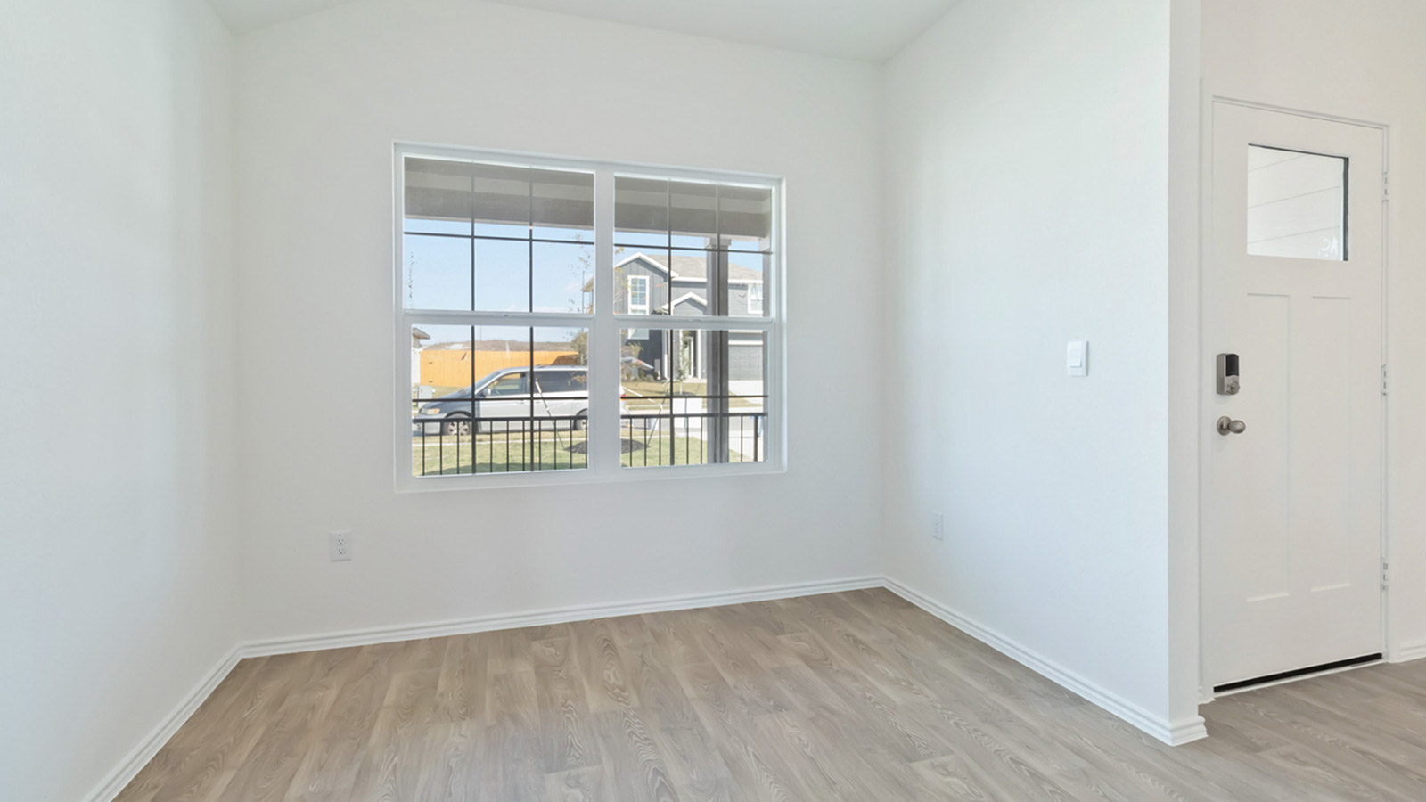 265 Balmorhea Street Kyle, TX 78640 - Photo 6 of 25 an empty room with a window