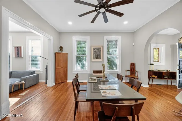a view of a dining room with furniture window and wooden floor