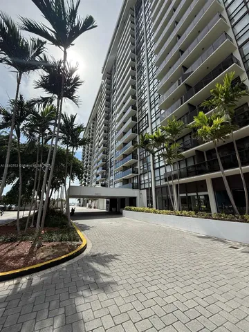 a view of a patio with table and chairs with wooden floor and fence