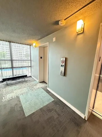 a bathroom with a double vanity sink a mirror and a bathtub