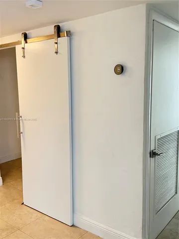 a view of a hallway with windows