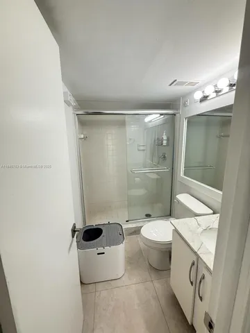 a bathroom with a sink double vanity and a mirror