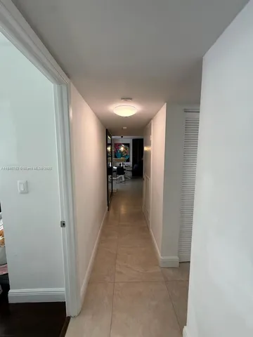 a view of a house with swimming pool and sitting area