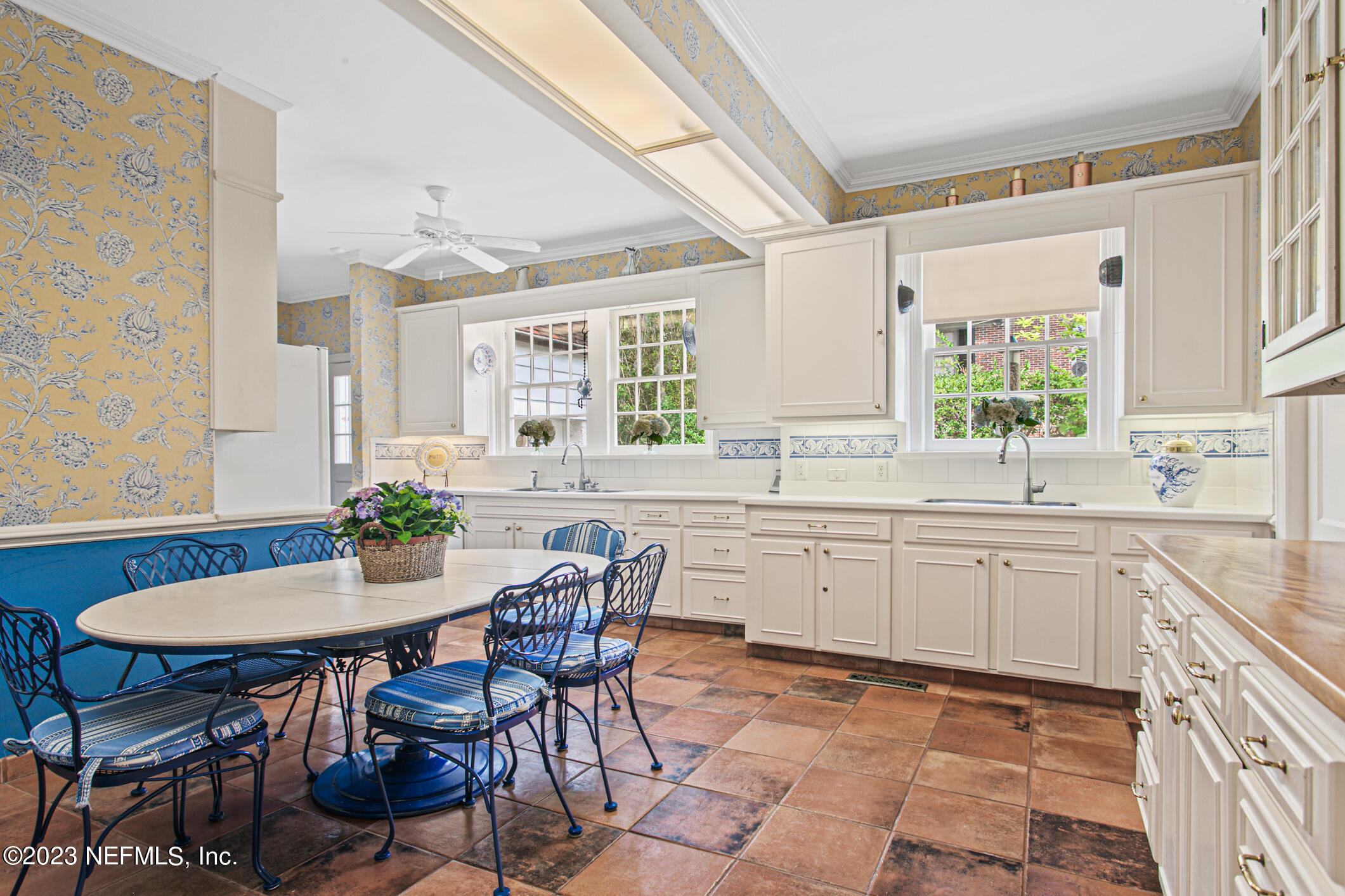 2103 River Road Jacksonville, FL 32207 - Photo 12 of 67 a kitchen with a dining table chairs and sink