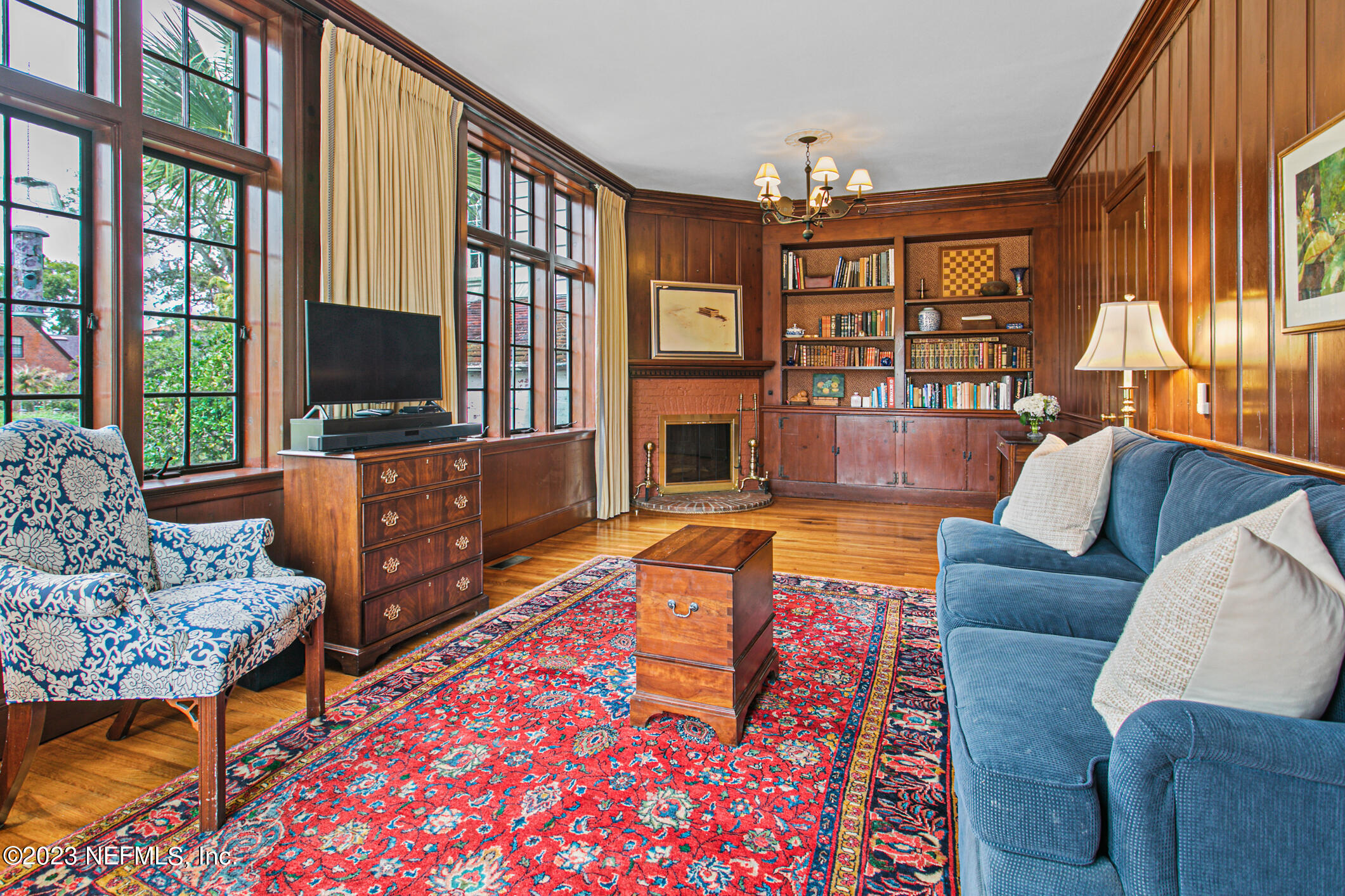 2103 River Road Jacksonville, FL 32207 - Photo 19 of 67 a living room with furniture a flat screen tv and a large window
