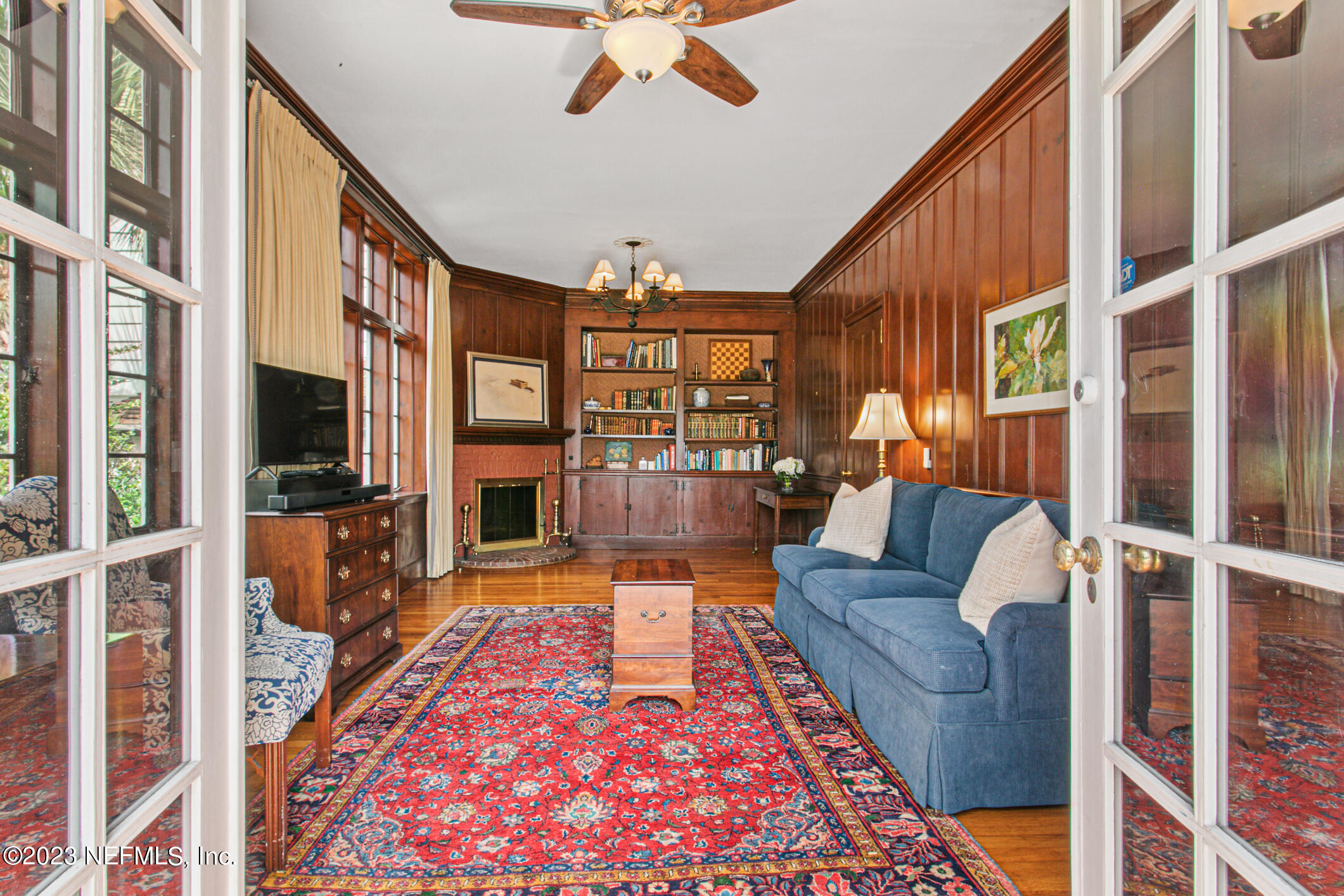 2103 River Road Jacksonville, FL 32207 - Photo 20 of 67 a living room with furniture flat screen tv and a rug
