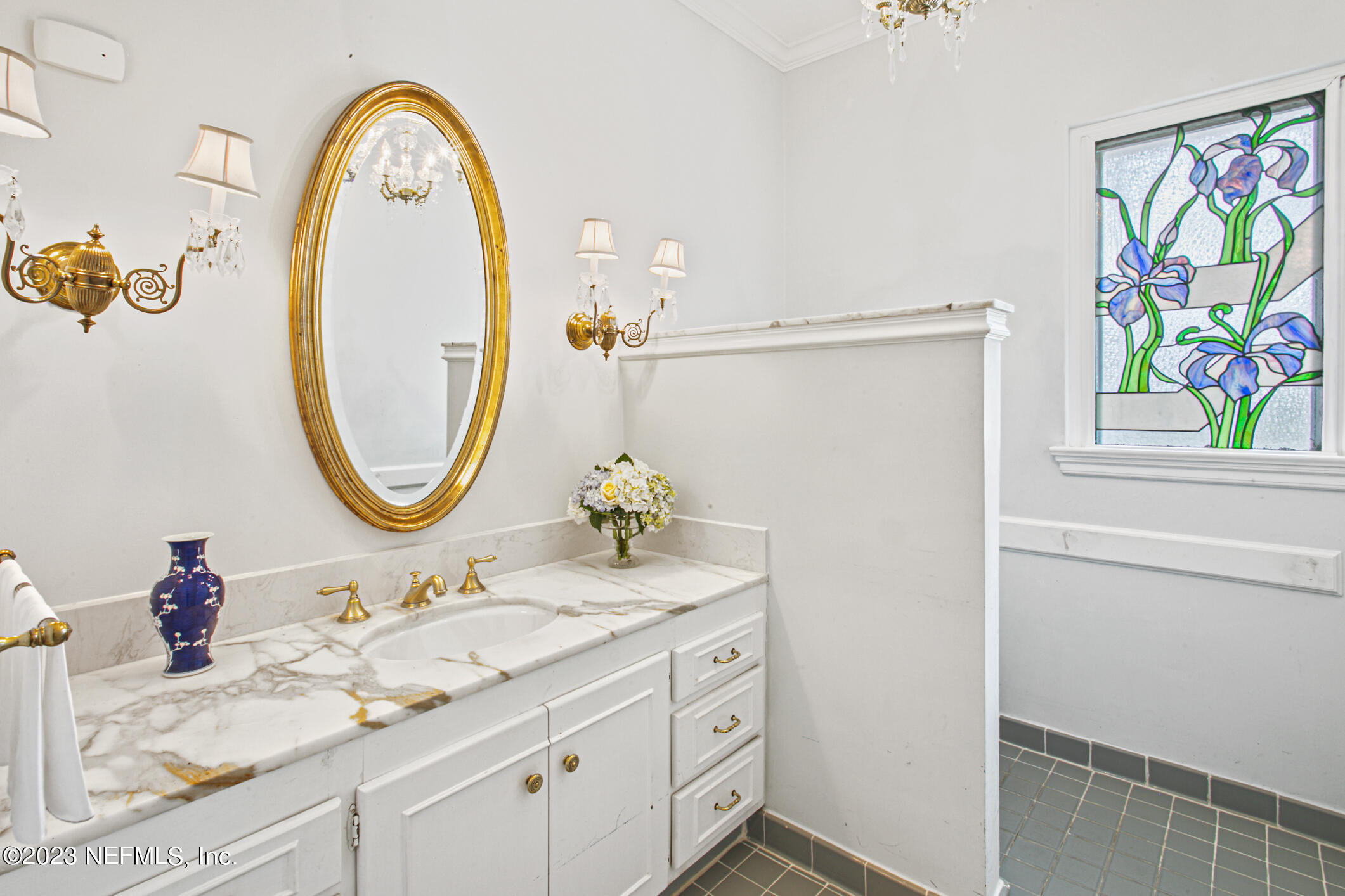 2103 River Road Jacksonville, FL 32207 - Photo 21 of 67 a bathroom with a granite countertop sink a mirror a vanity and a shower