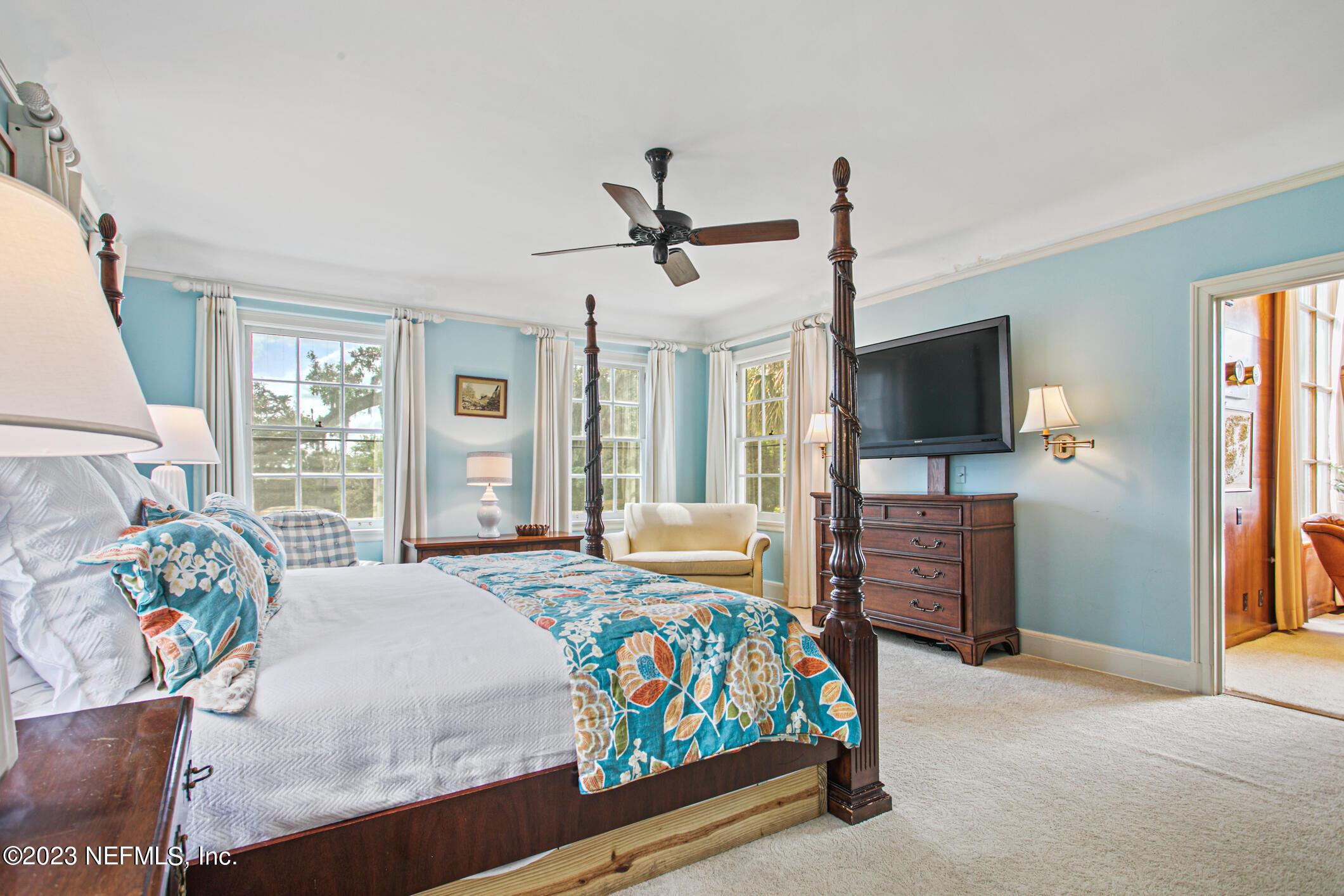 2103 River Road Jacksonville, FL 32207 - Photo 27 of 67 a bedroom with a bed and a flat screen tv