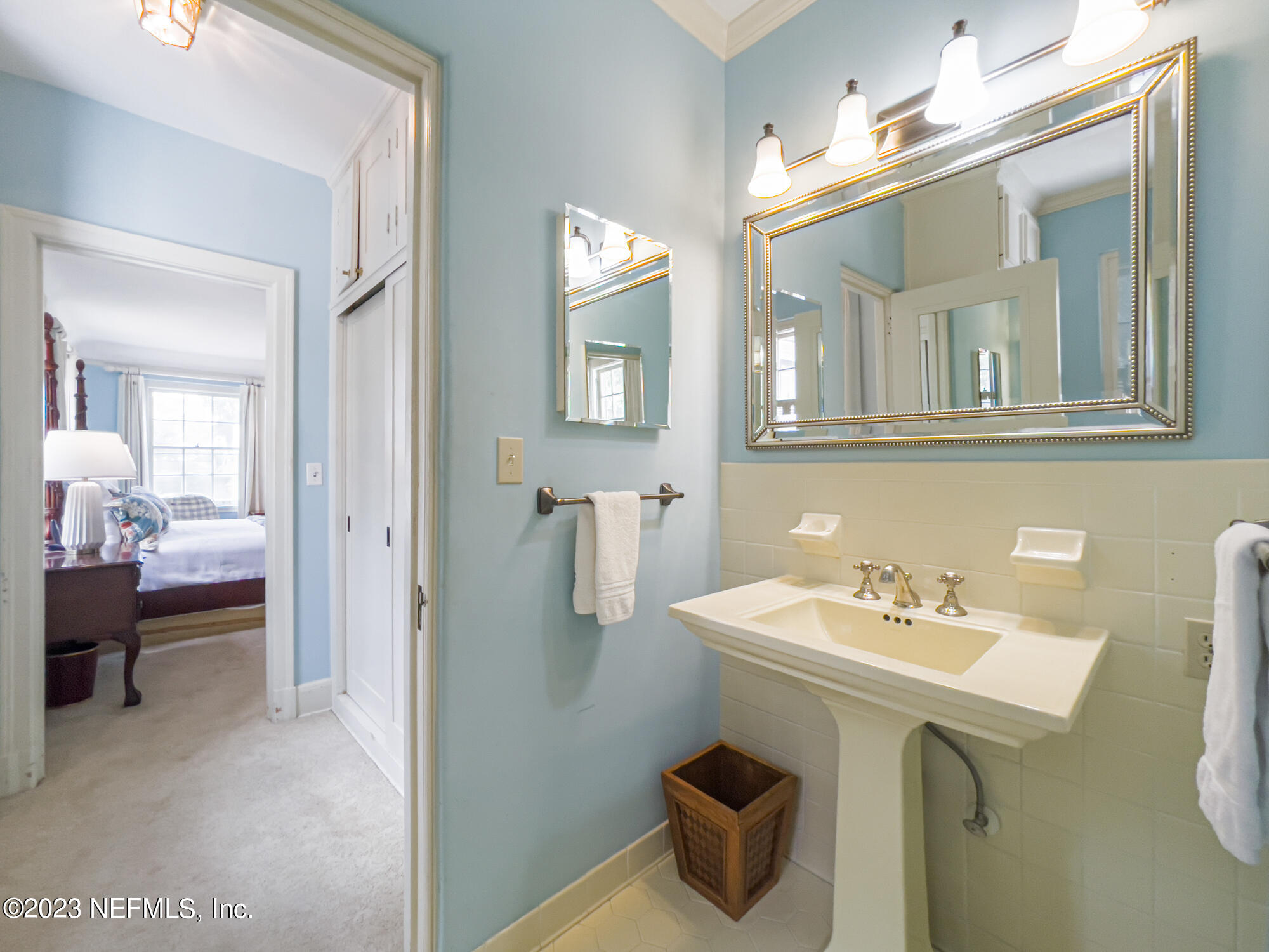2103 River Road Jacksonville, FL 32207 - Photo 30 of 67 a bathroom with a sink and a mirror