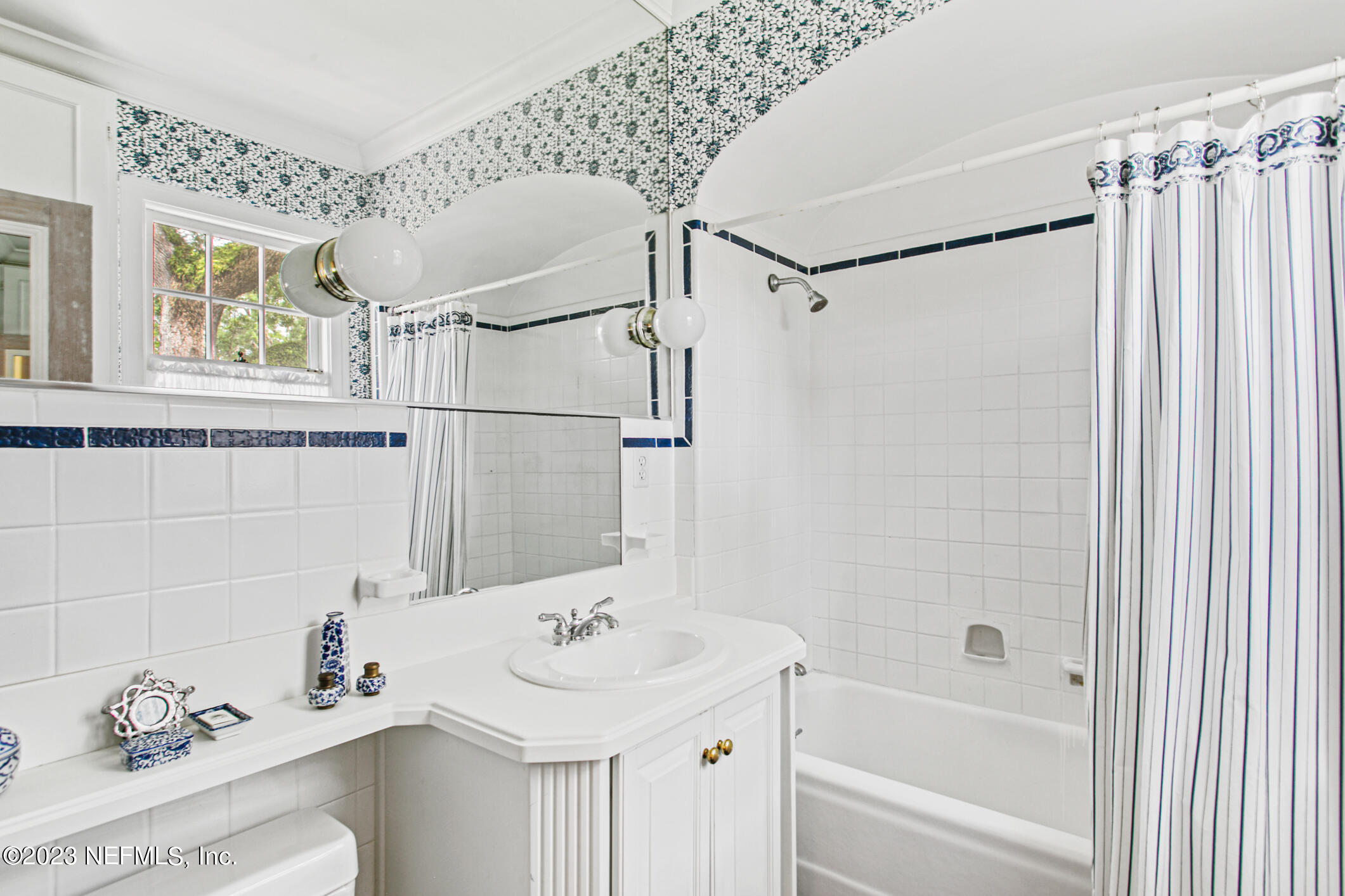 2103 River Road Jacksonville, FL 32207 - Photo 37 of 67 a bathroom with a sink and a mirror