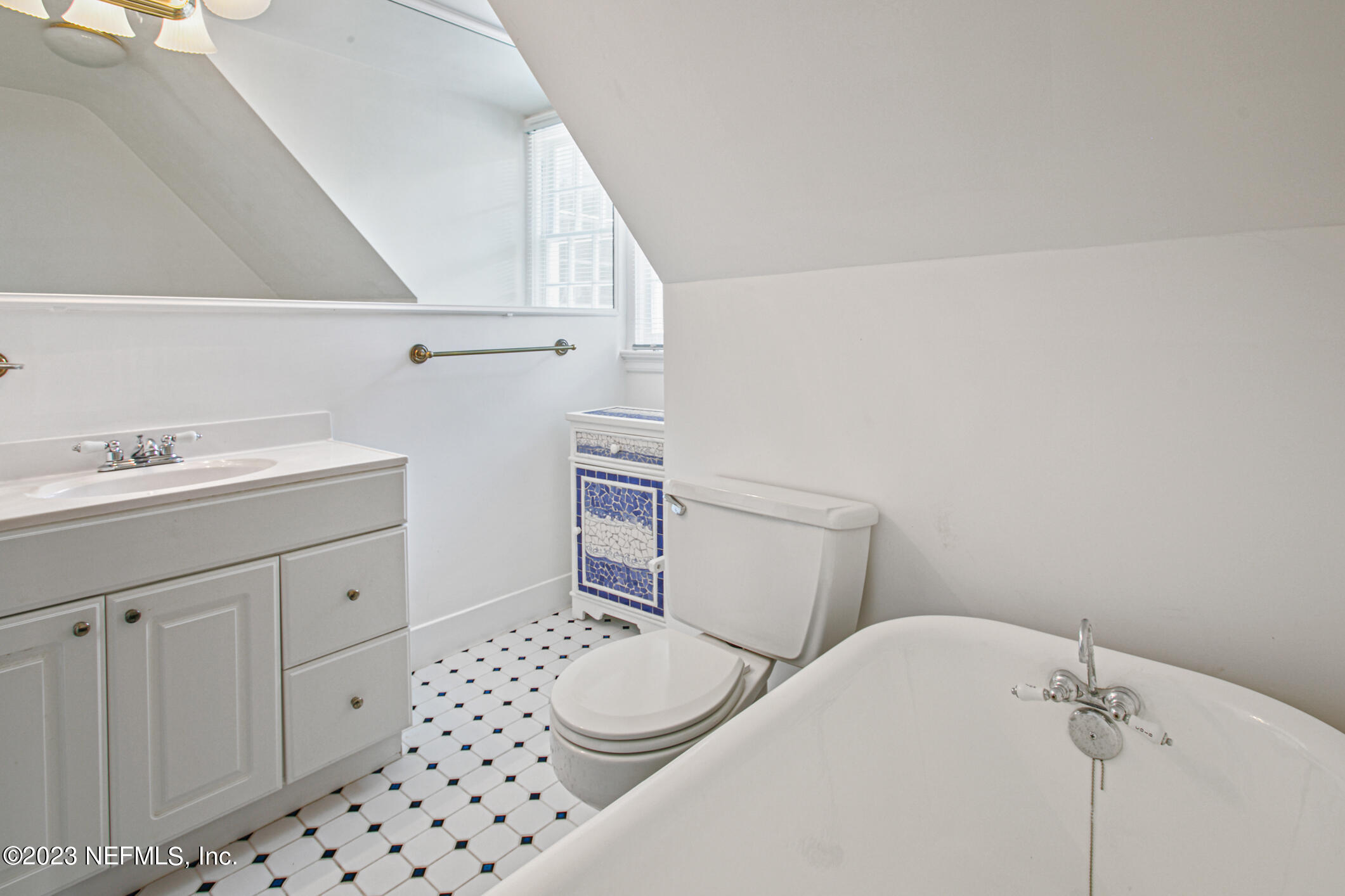 2103 River Road Jacksonville, FL 32207 - Photo 44 of 67 a bathroom with a sink a toilet and vanity