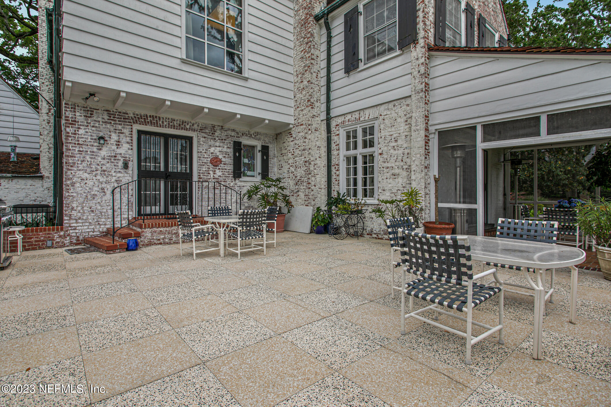 2103 River Road Jacksonville, FL 32207 - Photo 51 of 67 a view of a patio with a table and chairs and potted plants