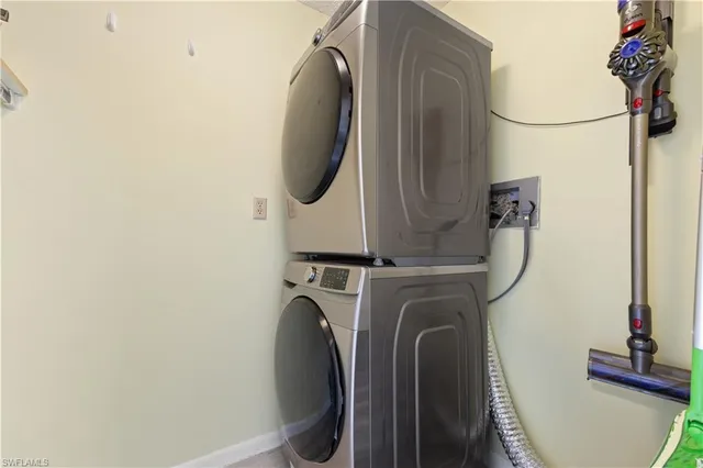 a close view of a utility room with dryer and washer