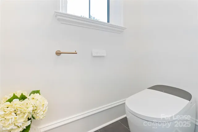 a bathroom with a toilet and a bathtub