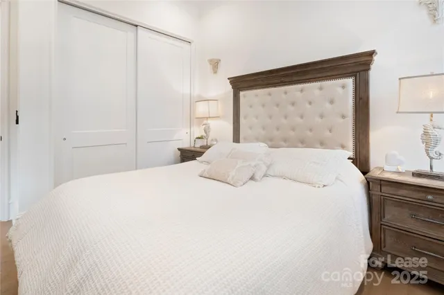 a large white bed in a white room
