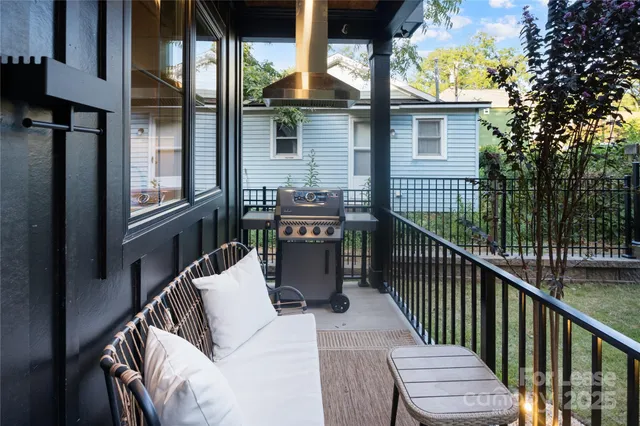 a view of balcony with furniture