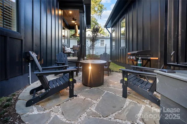 a view of an outdoor sitting area with furniture