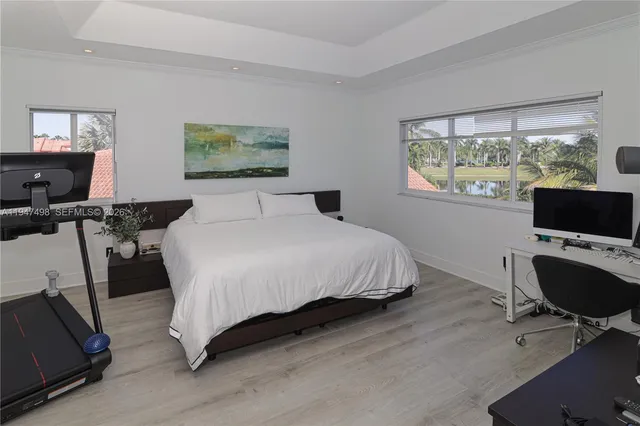 a bedroom with a bed a chair and table