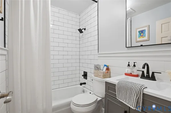 a bathroom with a toilet a sink and a bathtub