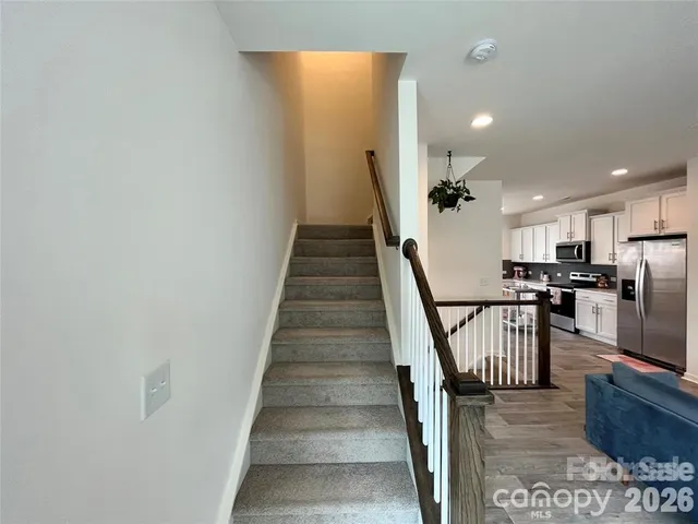 a view of a hallway with staircase