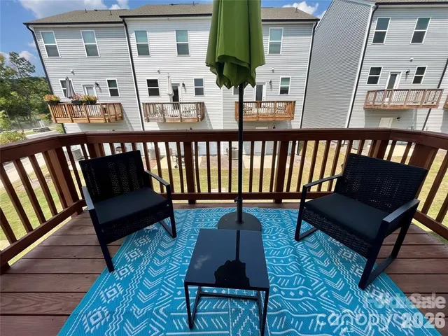 a view of a balcony with chairs