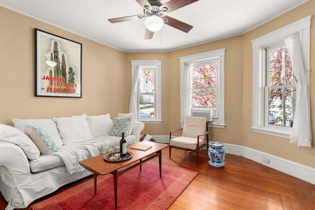 45 Springfield Street, Unit 1 Belmont, MA 02478 - Photo 6 of 27 a living room with furniture and a window