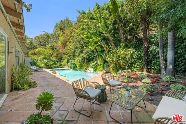 a view of a chairs and table in the patio