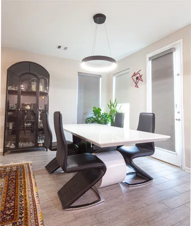 a work room with furniture lamp and rug