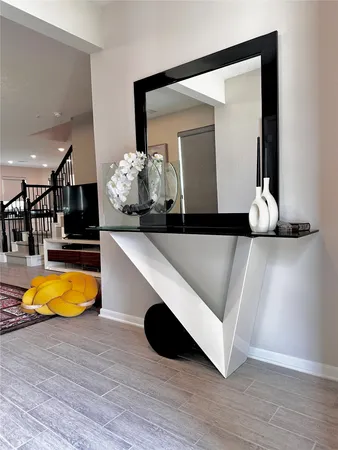 a living room with table and chairs