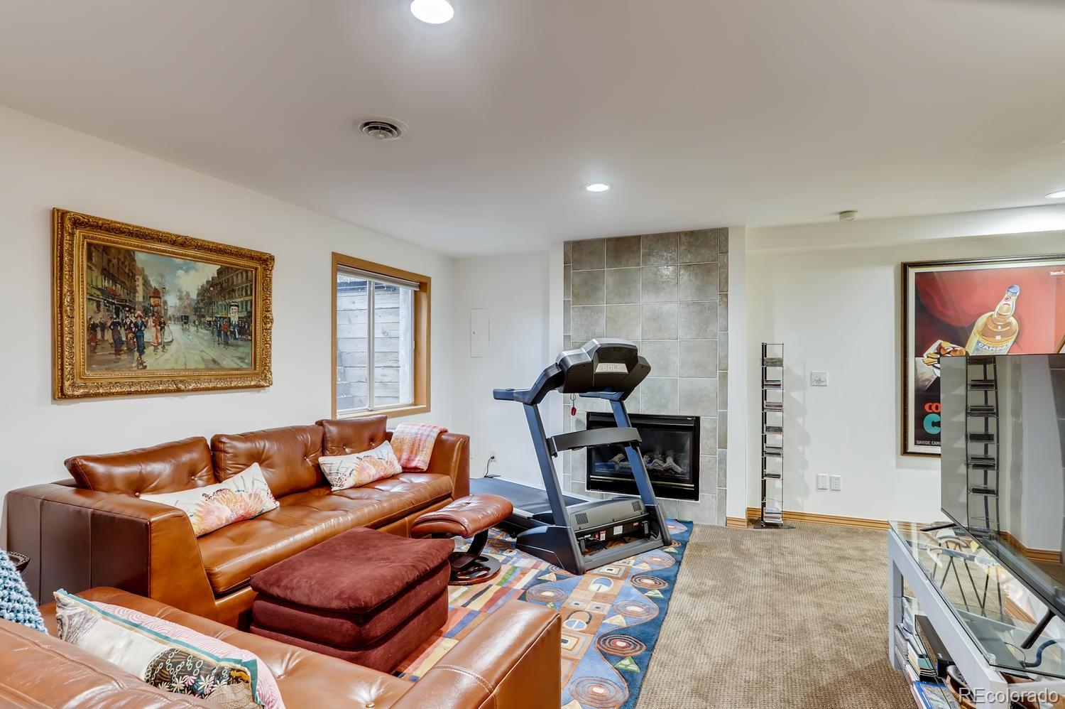 1450 Oakleaf Circle Boulder, CO 80304 - Photo 22 of 27 a living room with furniture a air conditioner vent and a window