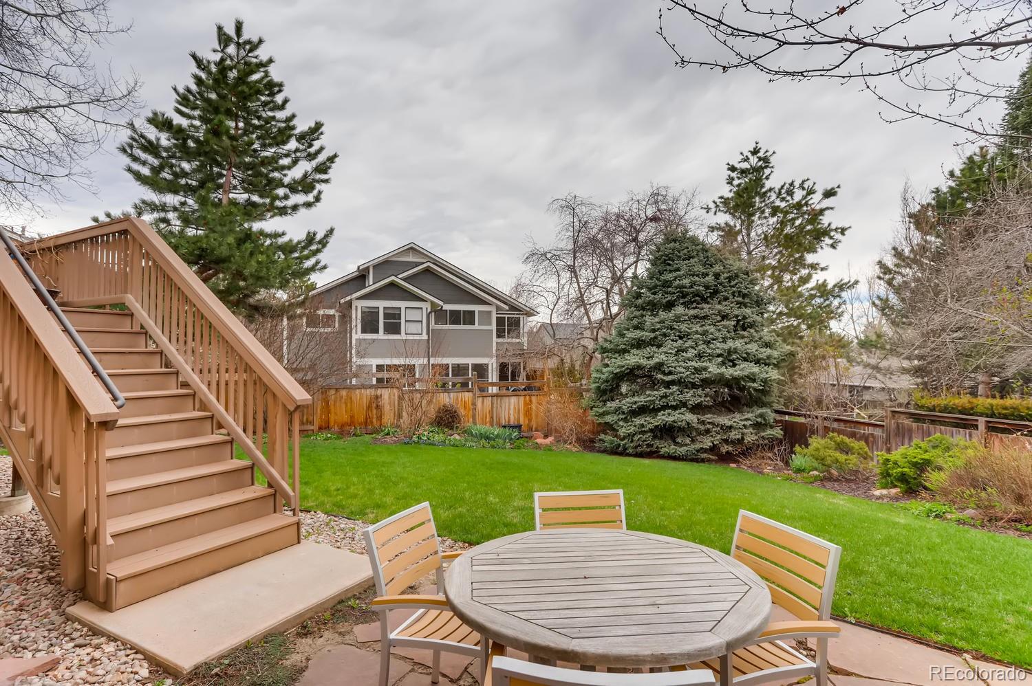 1450 Oakleaf Circle Boulder, CO 80304 - Photo 25 of 27 a view of a chair and table in backyard of the house