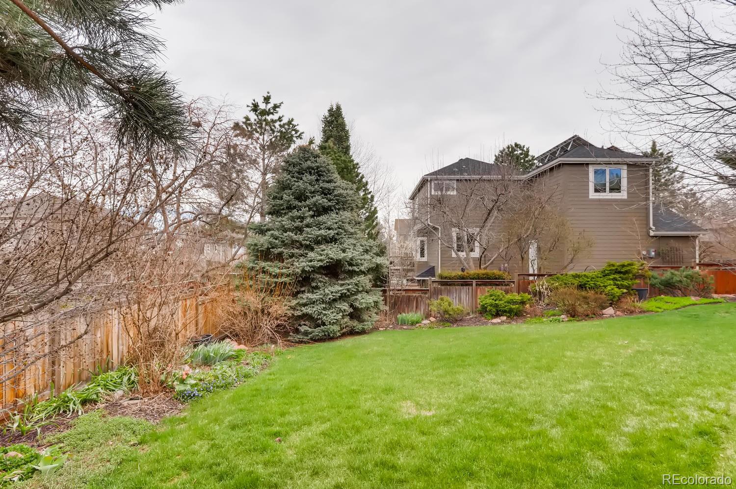1450 Oakleaf Circle Boulder, CO 80304 - Photo 27 of 27 a view of a house with a yard and sitting area